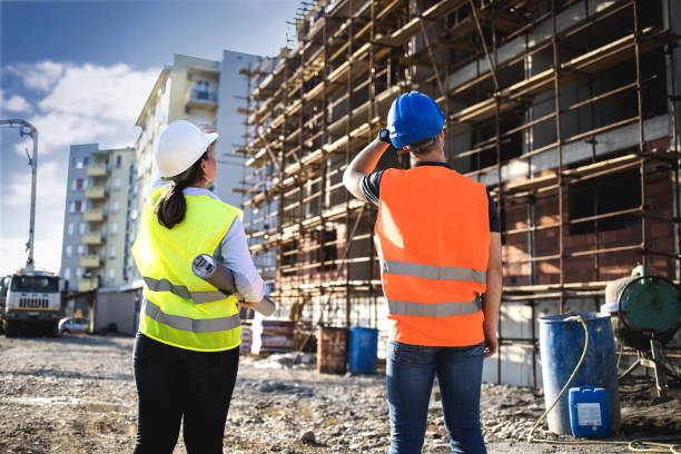 Two people at a construction site
