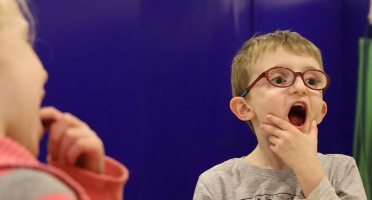 Ted practising mouth exercises at food school.