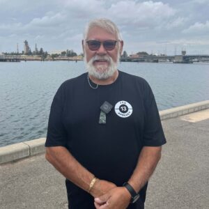 Man standing in front of river