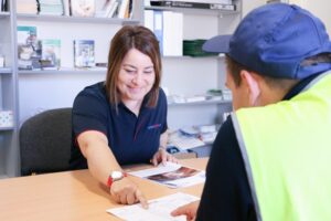 Vicki talking with a customer
