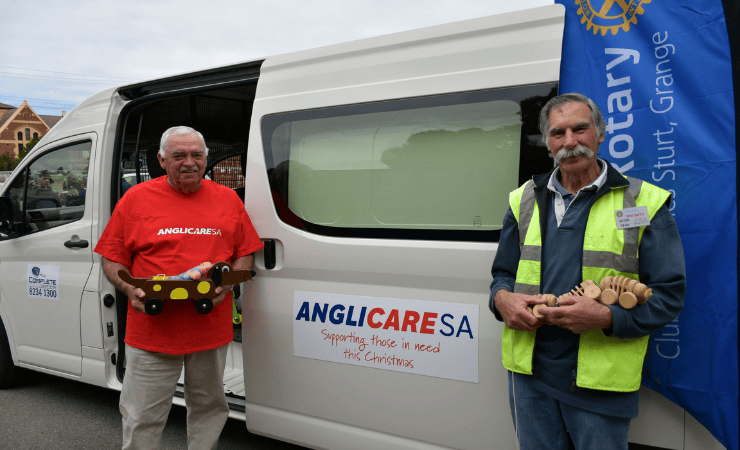 Two men helping to distribute the toys collected for the Christmas appeal