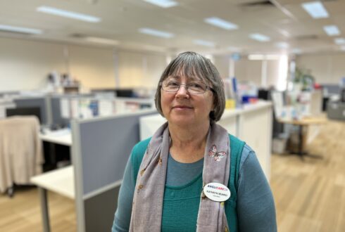 AnglicareSA volunteer Kathryn Munro smiles in the AnglicareSA offices.