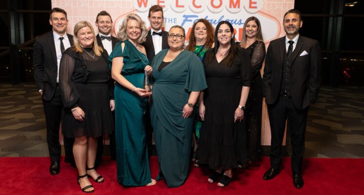 Beyond Housing Australia team standing together smiling and dressed up for the UDIA SA Awards.