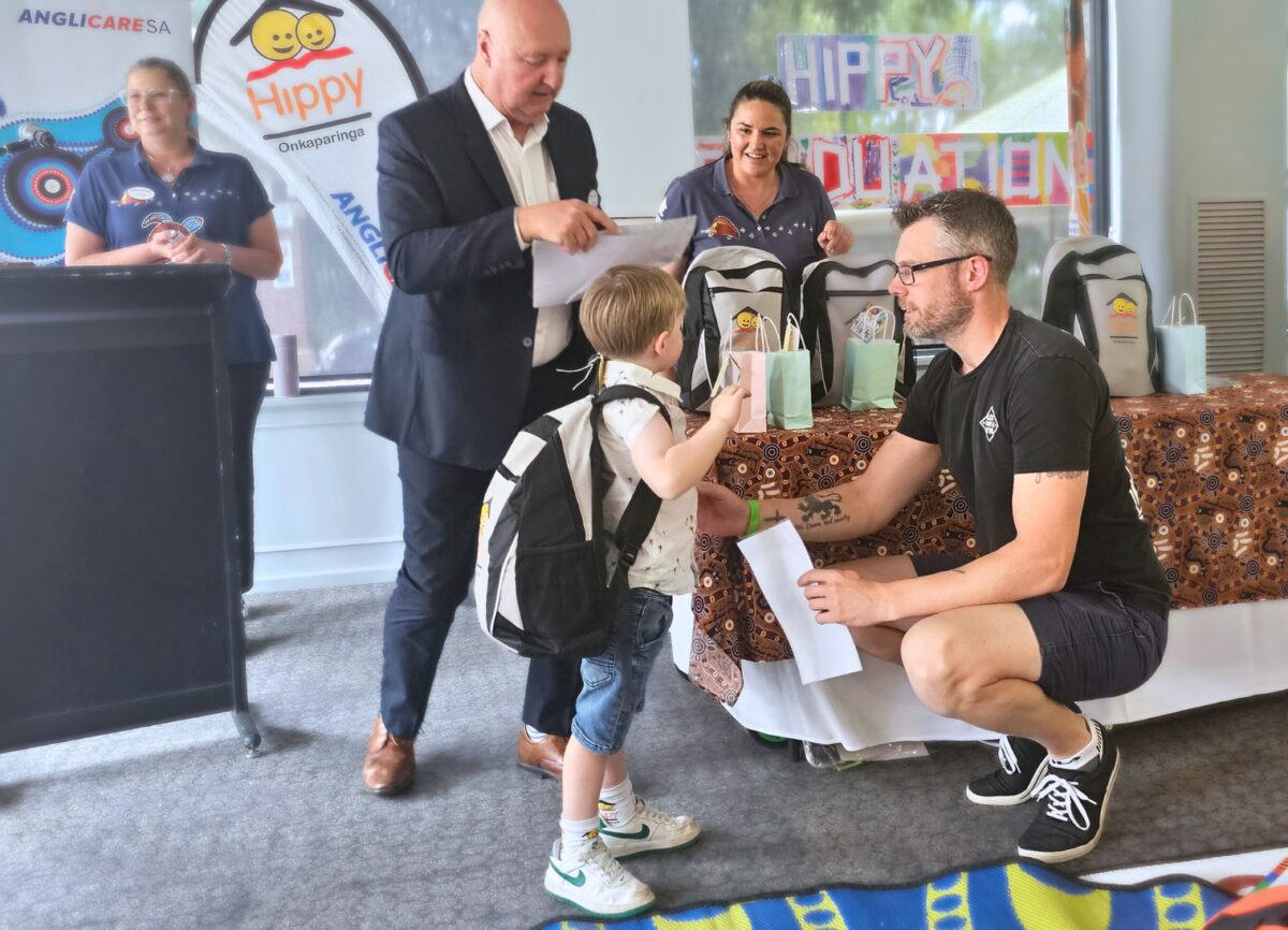 Blake together with his Dad as he accepts his certificate from Ian Dillon