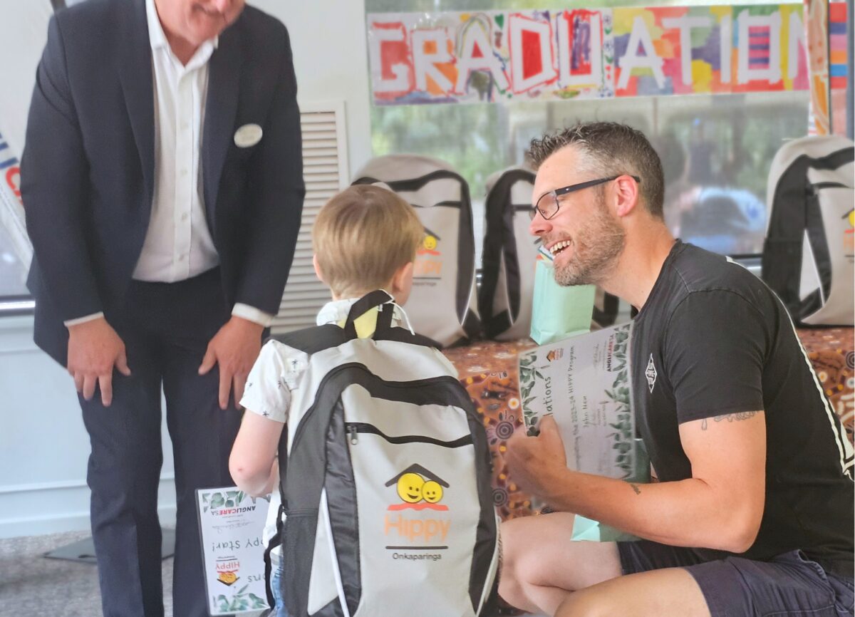 Blake together with his Dad as he accepts his certificate from Ian Dillon