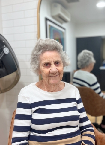 Margaret smiles at the camera showing of her fresh hairstyle.